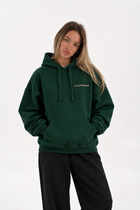 Polerón Essential Studios Flaw - Verde Botella - mujer en estudio - frente